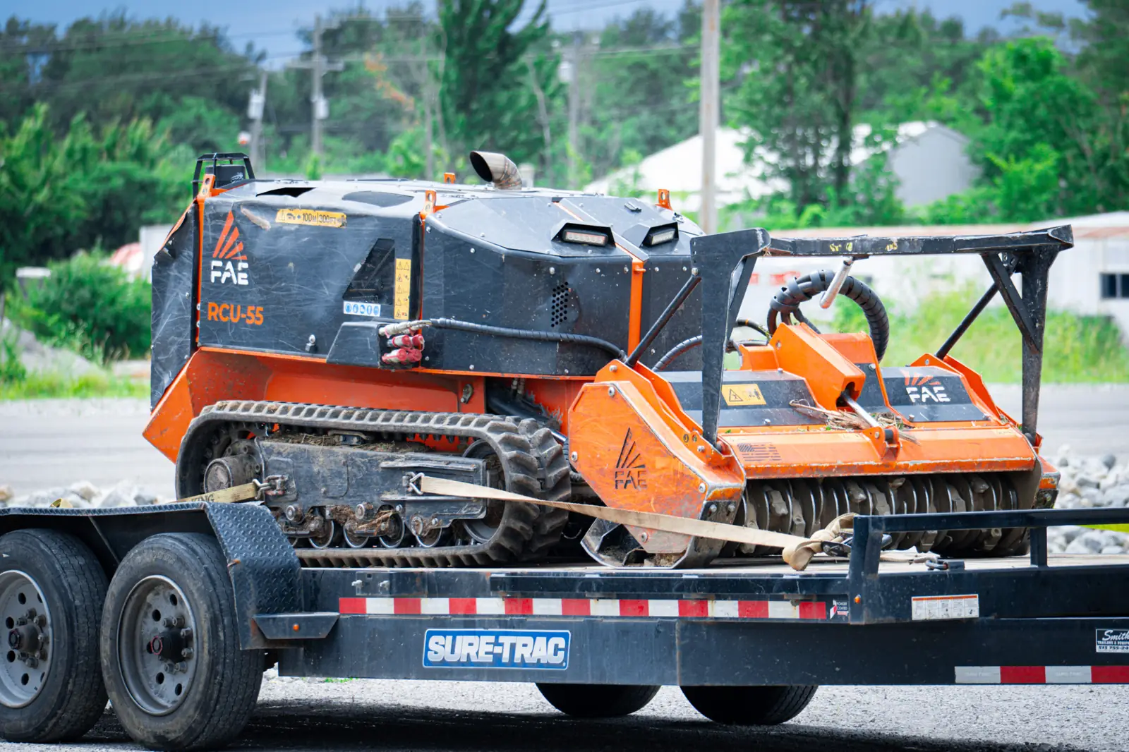 FAE RCU 55 remote mulcher strapped down on a Brushworks trailer