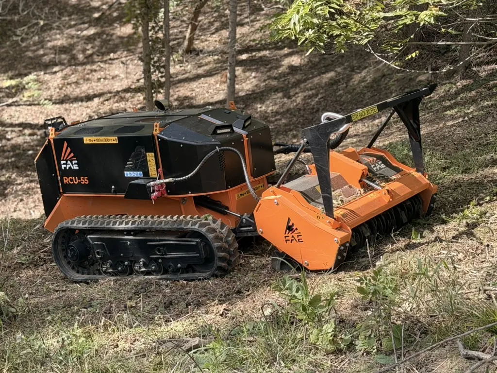 FAE RCU 55 remote-controlled mulcher positioned on a cleared wooded slope