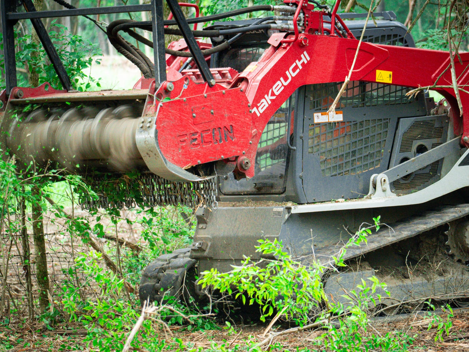 Close view of a real Fecon mulching head processing brush